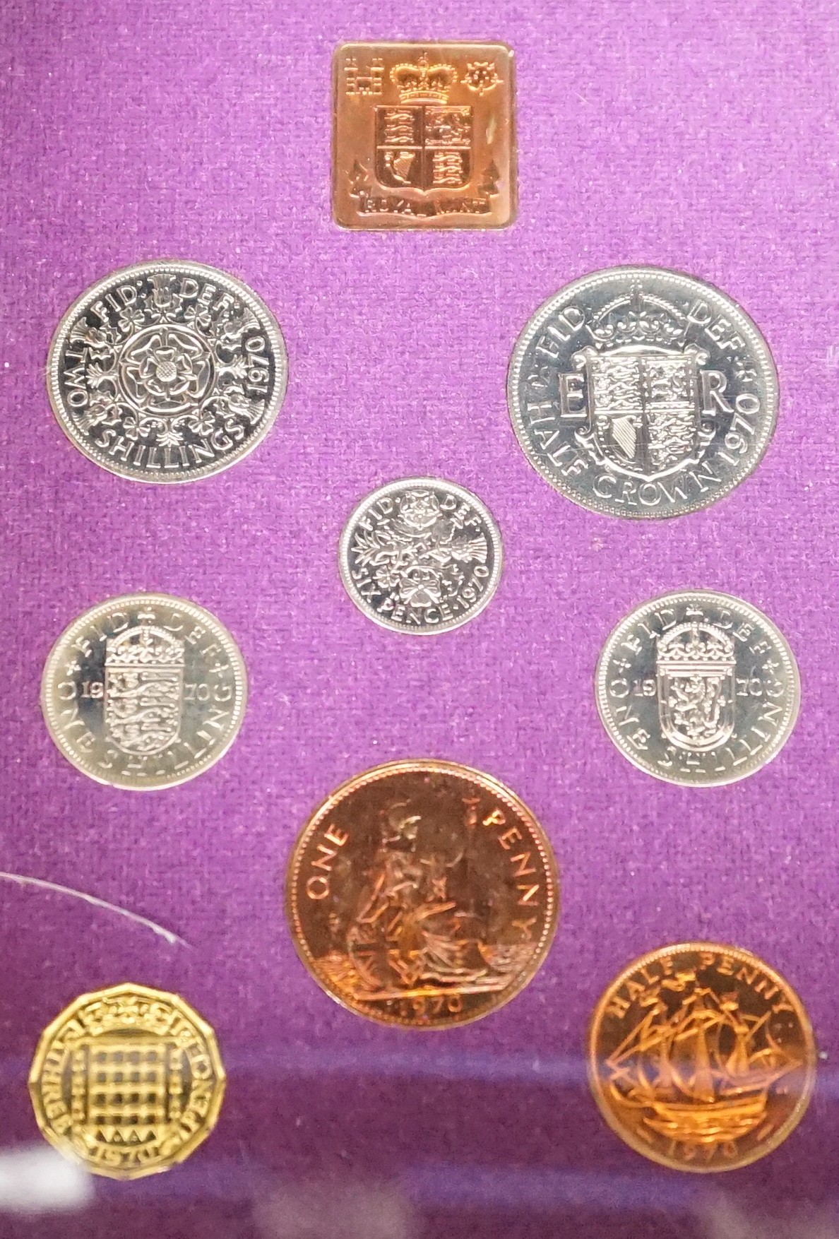 Twenty two cased Royal Mint UK proof coin year sets 1970-76, 1978-1989 including 1986 x 2, 1987 x 2, 1970 x 2, together with a 1953 BUNC set (23)